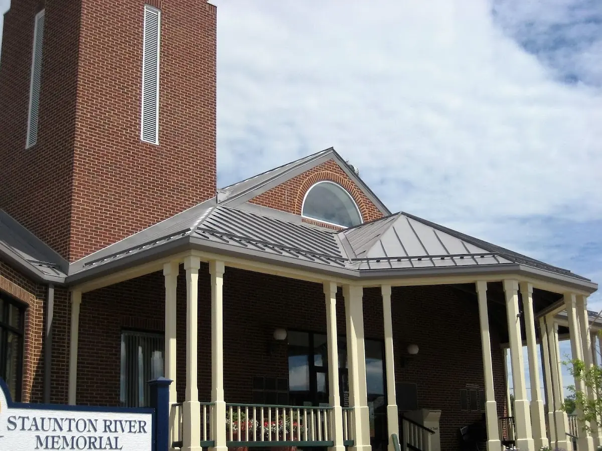 Skilled roofing craftsmen working on a residential roof in Warner Robins